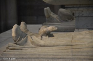 A fair number of the effigies have dogs or lions at their feet (in at least one case, the animal was snuggled up to the feet, as opposed to being stood on). The ferret seems to be unique, though.